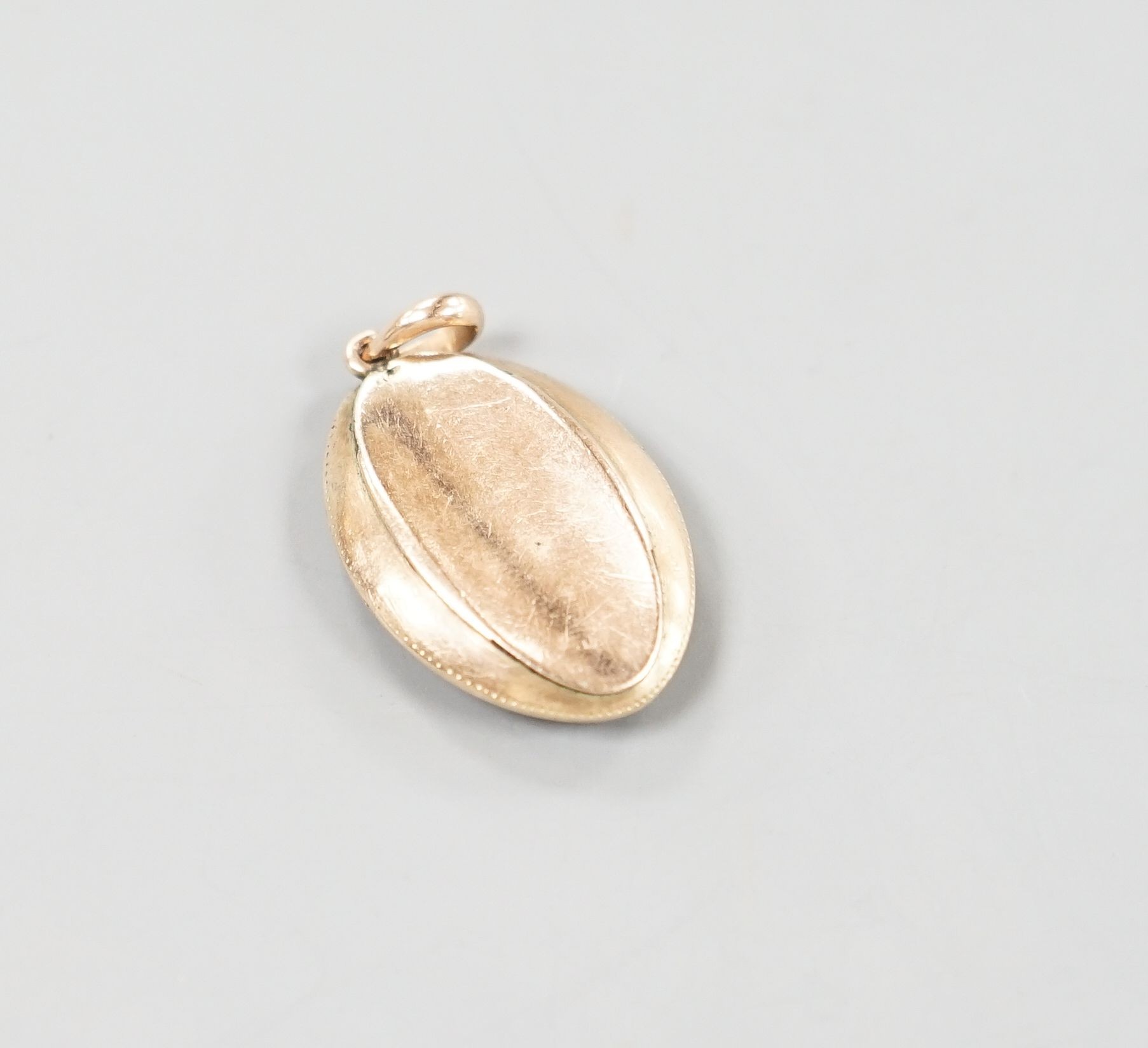 An early 19th century yellow metal, blue enamel and rose cut diamond chip set navette shaped 'monogram' pendant, 30mm, gross weight 5.8 grams.